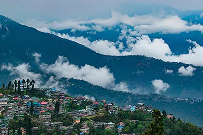 Darjeeling, a charming hill station known for tea gardens and Himalayan views.
