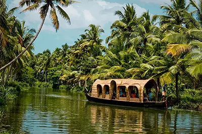 Kerala, God’s Own Country known for backwaters, greenery, and serene beaches.